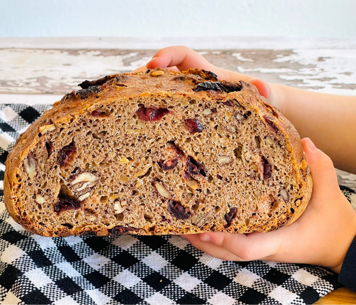 https://mirjamskitchenyodel.com kids hands holding no-knead bread