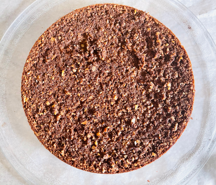 https://mirjamskitchenyodel.com rich & moist chocolate almond cake sliced open bisquit