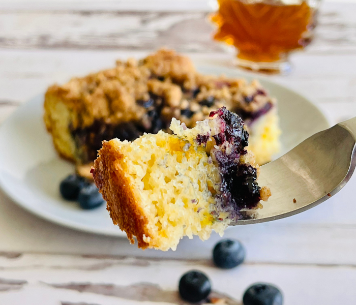 https://mirjamskitchenyodel.com blueberry pancake casserole a bite on a fork