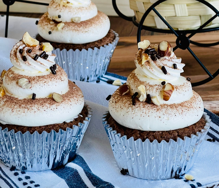 https://mirjamskitchenyodel.com chocolate maple cupcakes two cupcakes close up