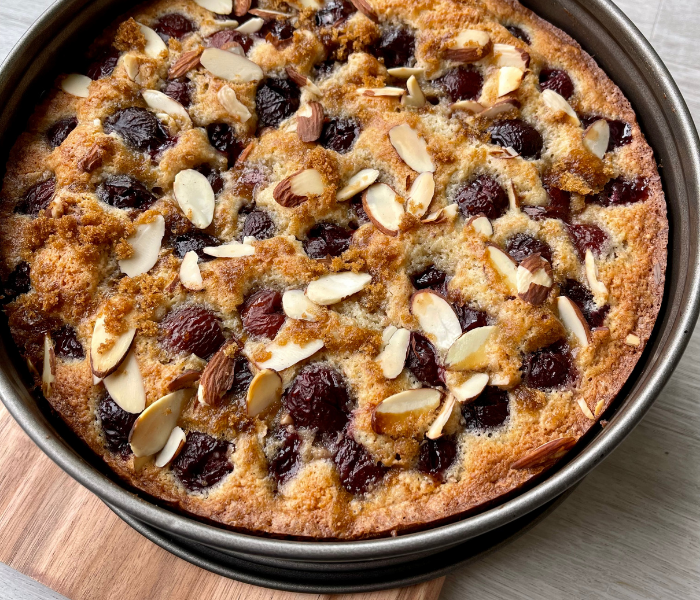 https://mirjamskitchenyodel.com cherry almond cake fresh out of the oven