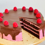 https://mirjamskitchenyodel.com chocolate raspberry cake one slice cut out