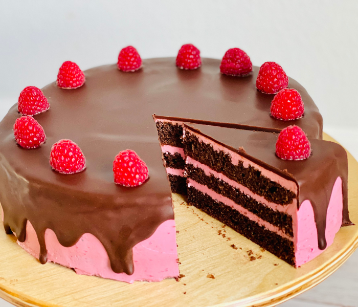 https://mirjamskitchenyodel.com chocolate raspberry cake one slice cut out