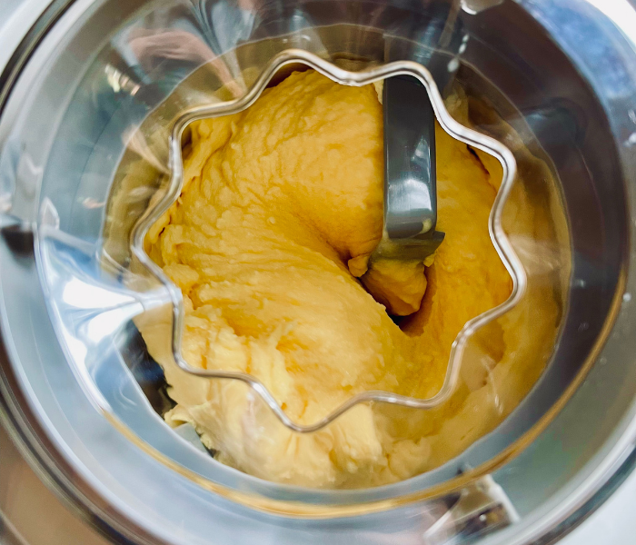 https://mirjamskitchenyodel.com peach ice cream in the ice cream maker