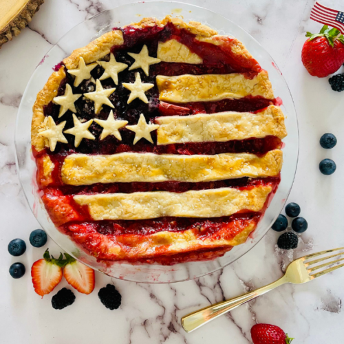 https://mirjamskitchenyodel.com american flag berry pie with berries for decoration