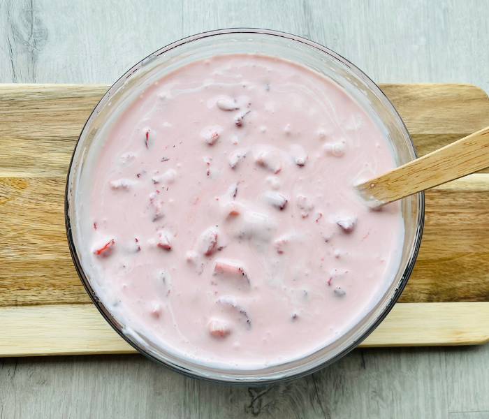 https://mirjamskitchenyodel.com strawberry ice cream ready to be poured into ice cream maker