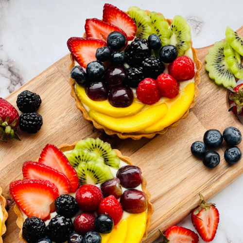 https://mirjamskitchenyodel.com classic french fruit tart on wooden board