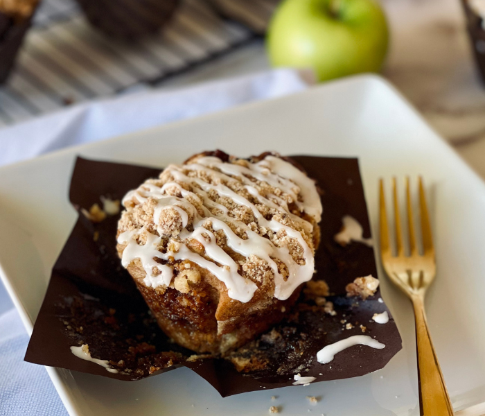 https://mirjamskitchenyodel.com apple cinnamon streusel muffins with wrapper folded down