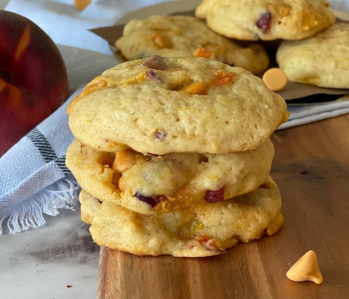 https://mirjamskitchenyodel.com peach butterscotch cookies stacked on top of each other