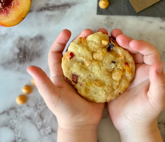 https://mirjamskitchenyodel.com peach butterscotch cookies in kid's hands