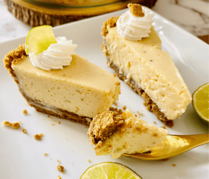 https://mirjamskitchenyodel.com a piece of key lime pie on a fork