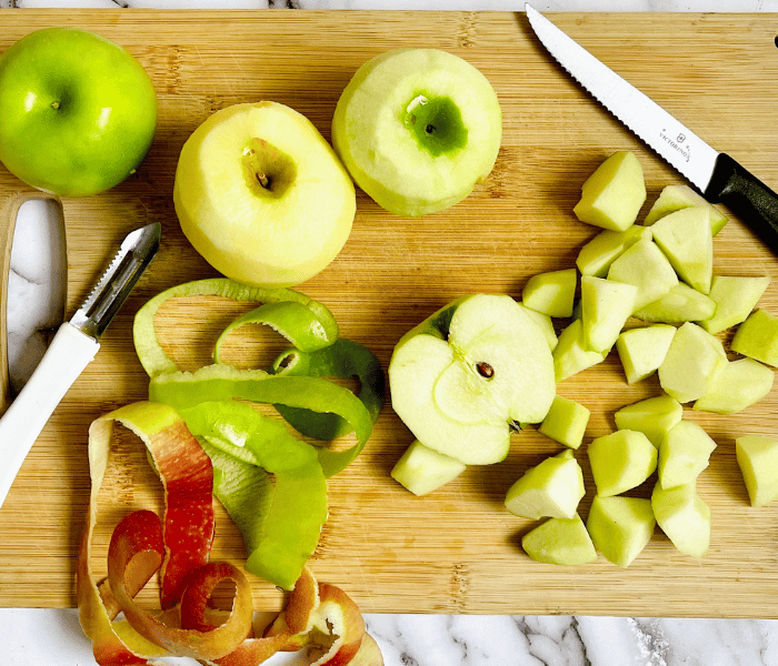 https://mirjamskitchenyodel.com peeled apples on cutting board 