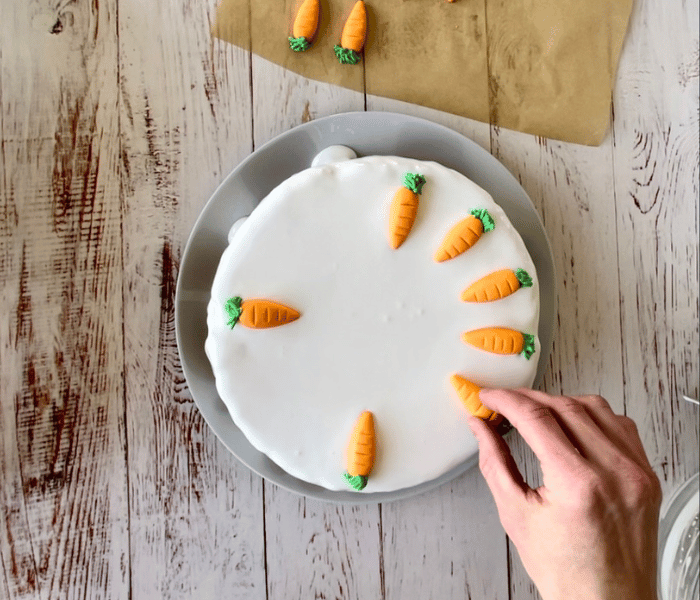 https://mirjamskitchenyodel.com classic swiss carrot cake adding fondant carrots to the cake